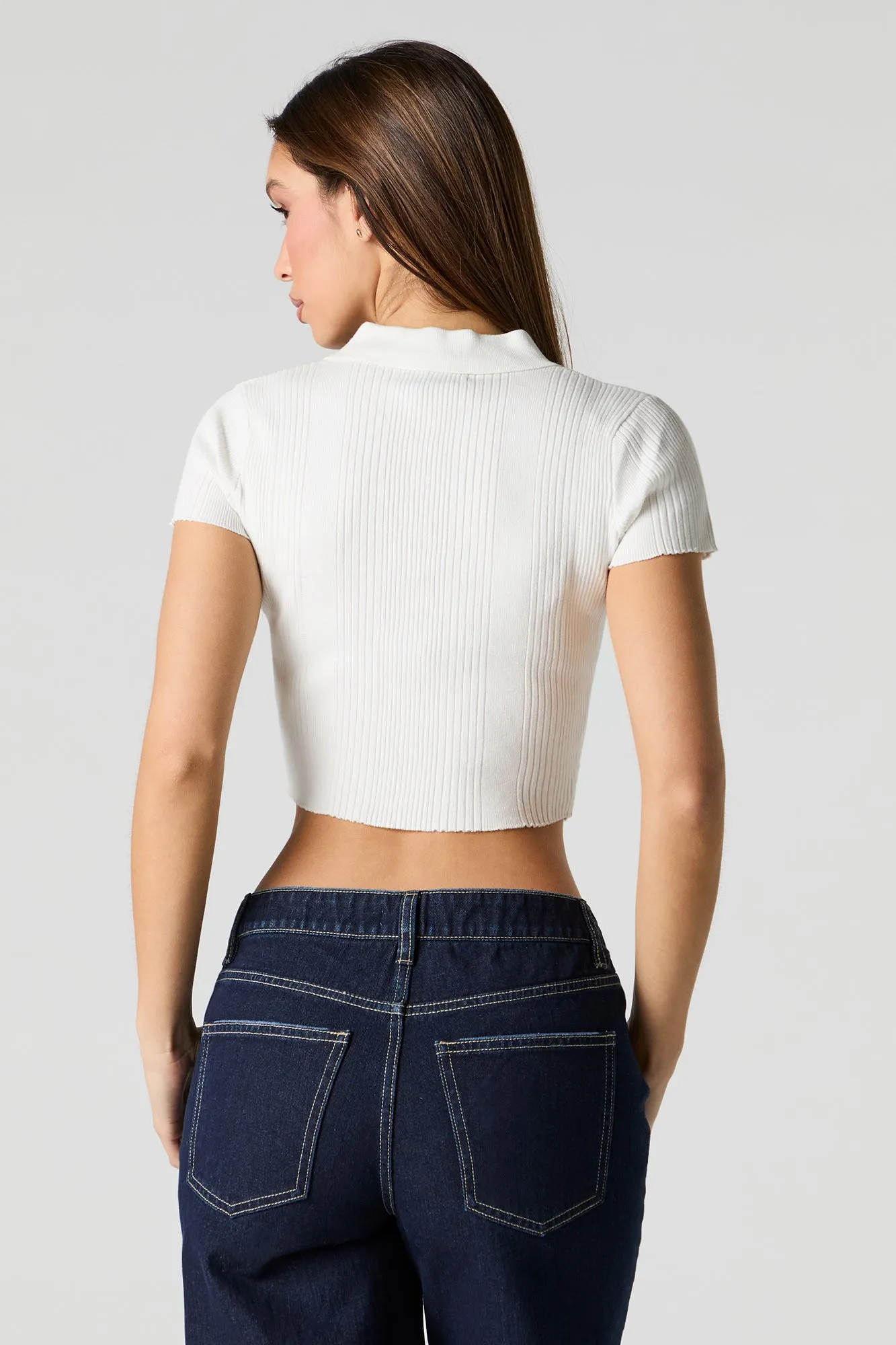 Polo boutonné en tricot côtelé
