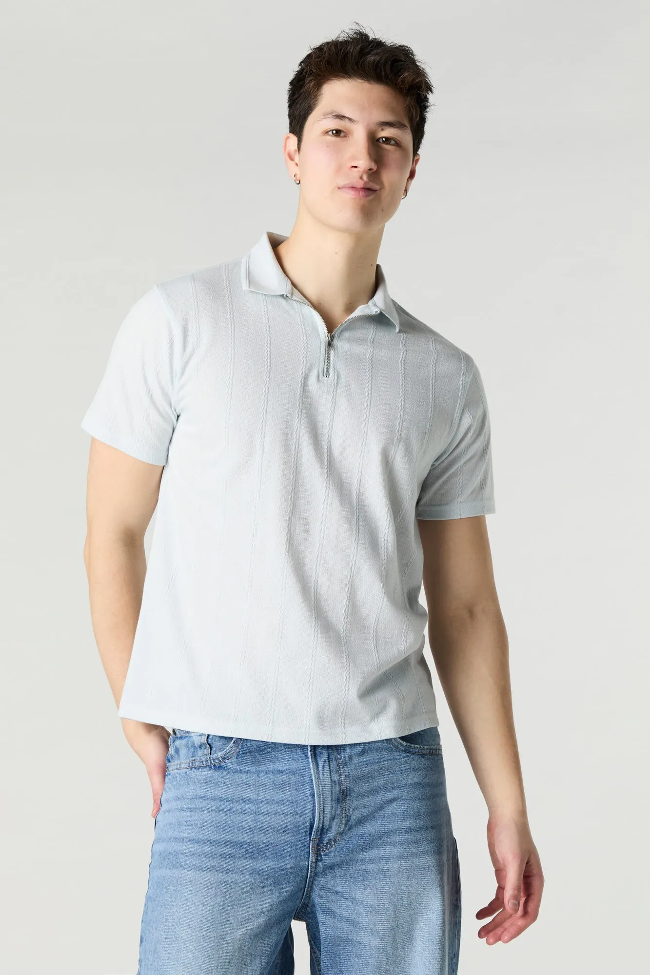 Polo texturé avec fermeture à glissière